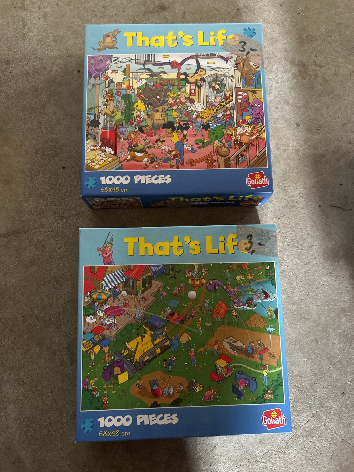 2x That's Life 1000 stukjes puzzels van Goliath, Ophalen, 500 t/m 1500 stukjes, Gebruikt, Legpuzzel
