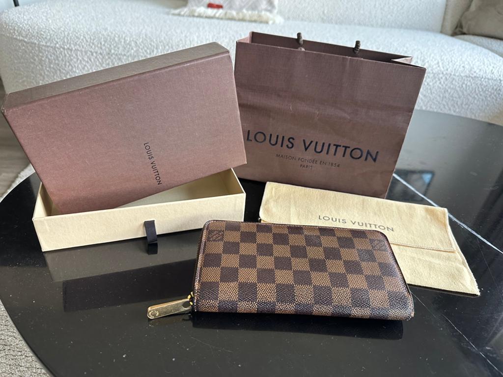 Orginele Louis Vuitton Damier Ebene Zippy Wallet, Ophalen of Verzenden, Zo goed als nieuw, Bruin, Overige merken