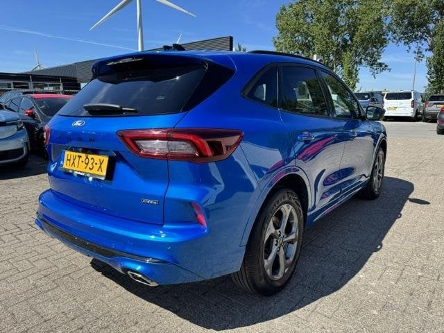 Ford Kuga 2.5 PHEV ST-Line X 243pk | Trekhaak | Winterpack |, Auto's, Ford, 14 kWh, Gebruikt, Blauw, Leder en Stof