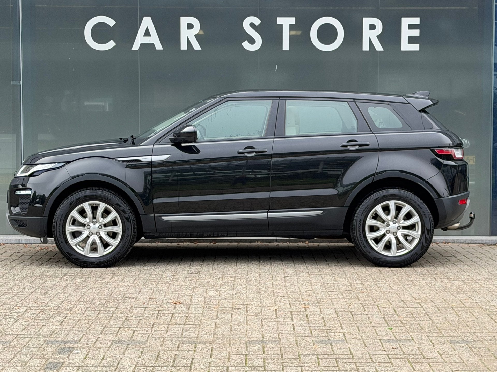 Land Rover Range Rover Evoque 2.0 Si4 Urban Series SE Leer /, Auto's, Automaat, Dealer onderhouden, 4 cilinders, Zwart