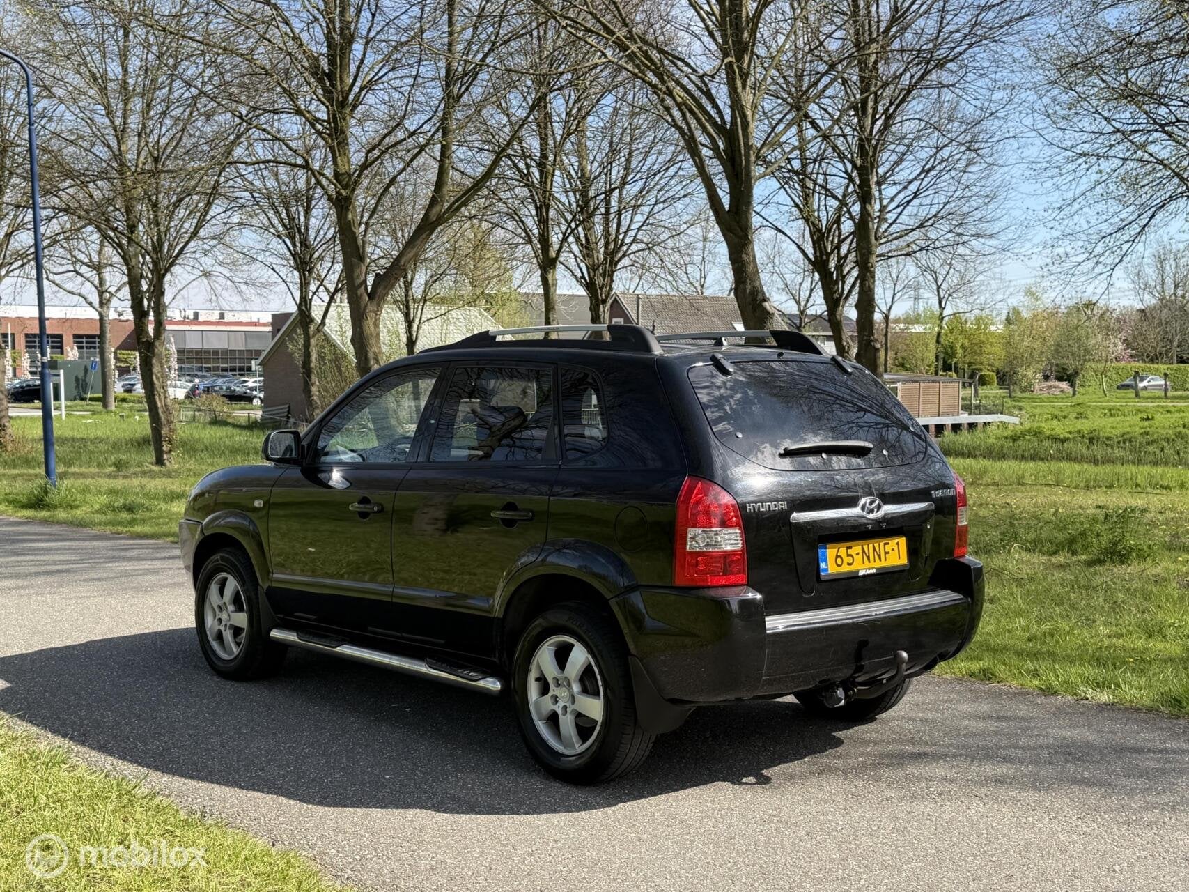 Hyundai Tucson 2.0i Active*LEDER*STOELVERWARMING*NEW APK, Auto's, Gebruikt, 4 cilinders, Stoelverwarming, Zwart