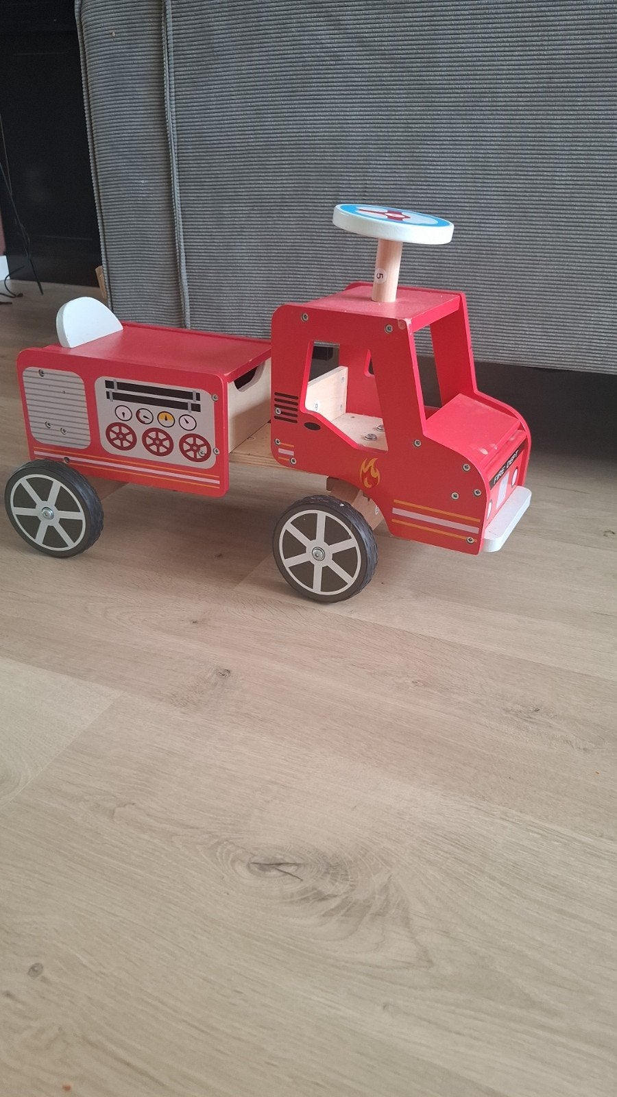 Houten loopauto brandweerwagen, Ophalen