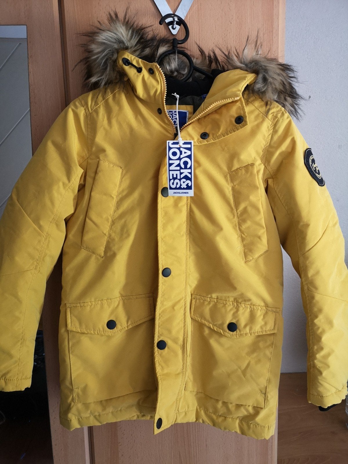 Winterjas Jack & Jones 152 geel, Jongen of Meisje, Nieuw, Ophalen of Verzenden, Jack & Jones