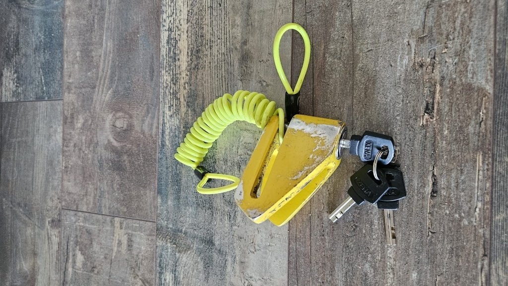 Schijfremslot  geel, Ophalen, Gebruikt