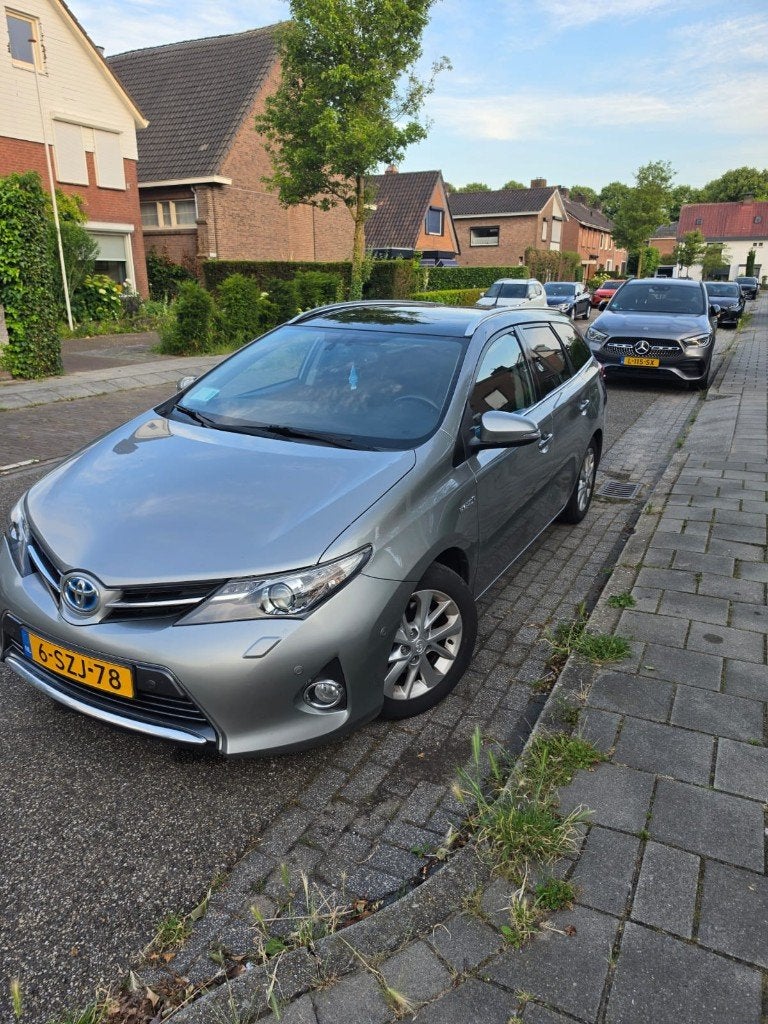 Toyota Auris 1.8 Hybrid Touring Sports CVT 2014 Grijs, Auto's, Stof, Zwart, 345 kg, Origineel Nederlands