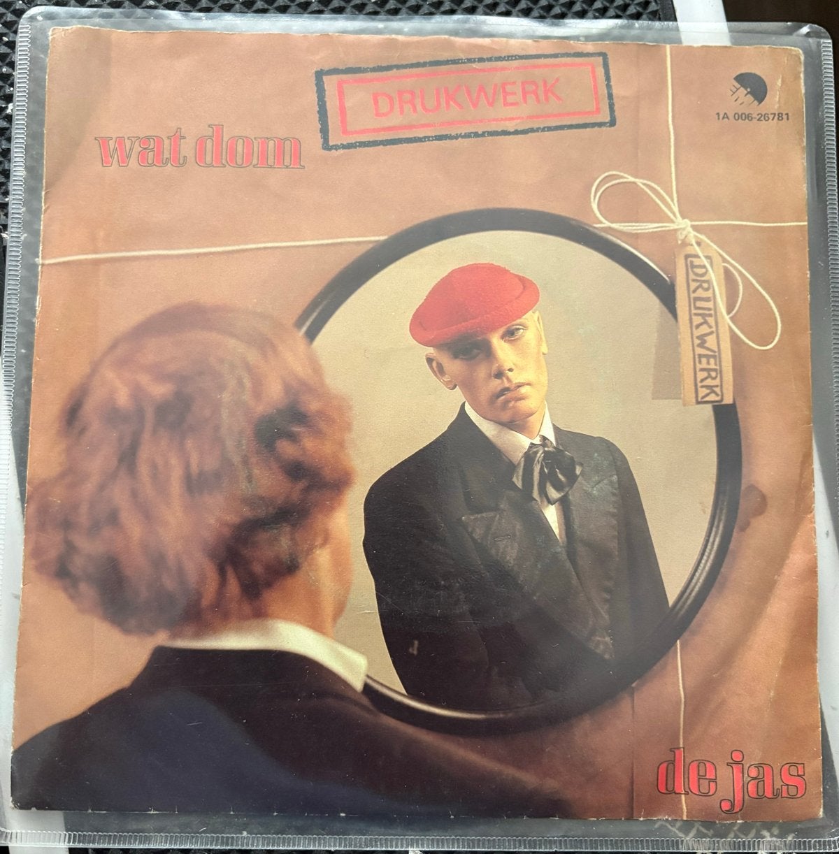 Drukwerk - Wat Dom / De Jas (Single, 1981), Originele persing, Ophalen of Verzenden, Gebruikt, Nederlandstalig