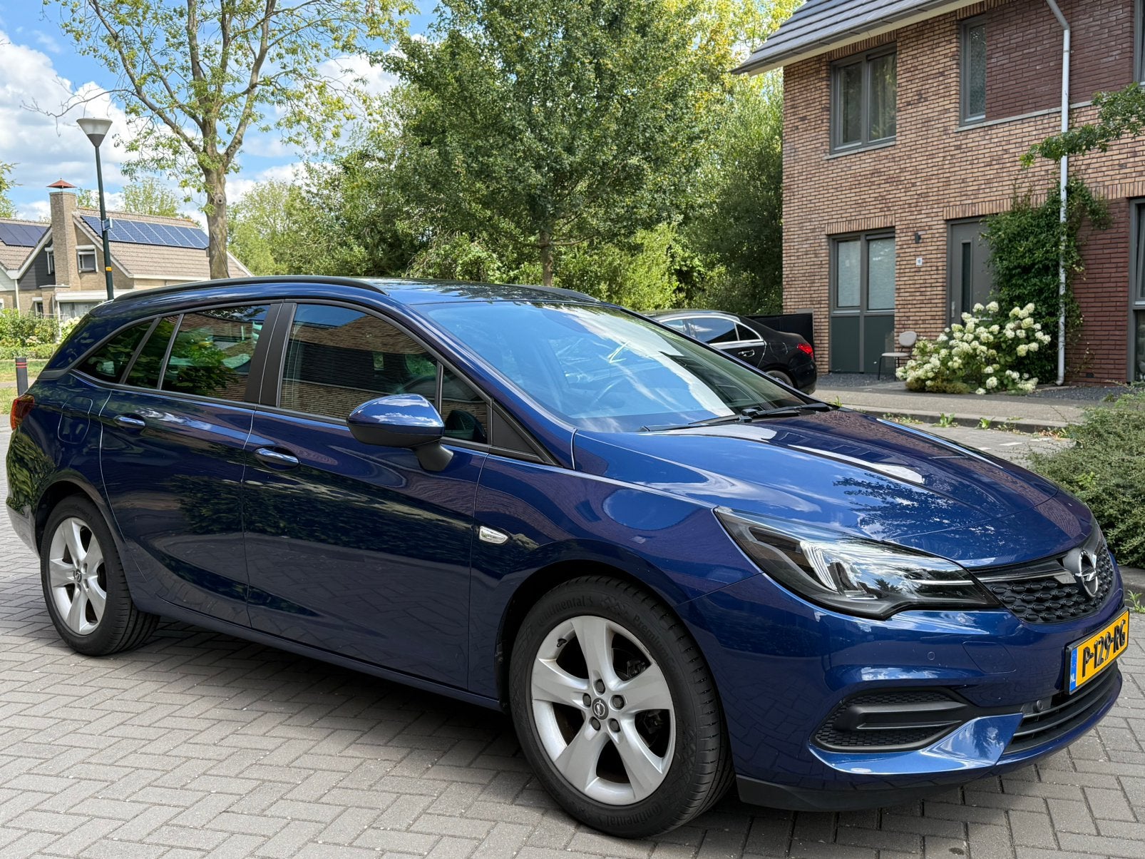 Opel Astra 1.2 Turbo 130pk Start/stop 2021 Blauw, Auto's, 1250 kg, 1199 cc, Blauw, Stationwagon