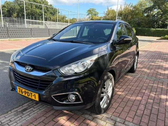 Hyundai iX35 2.0i Cvvt 163pk Aut. 2011 Zwart, Auto's, 1998 cc, Zwart, 4 cilinders, 75 €/maand