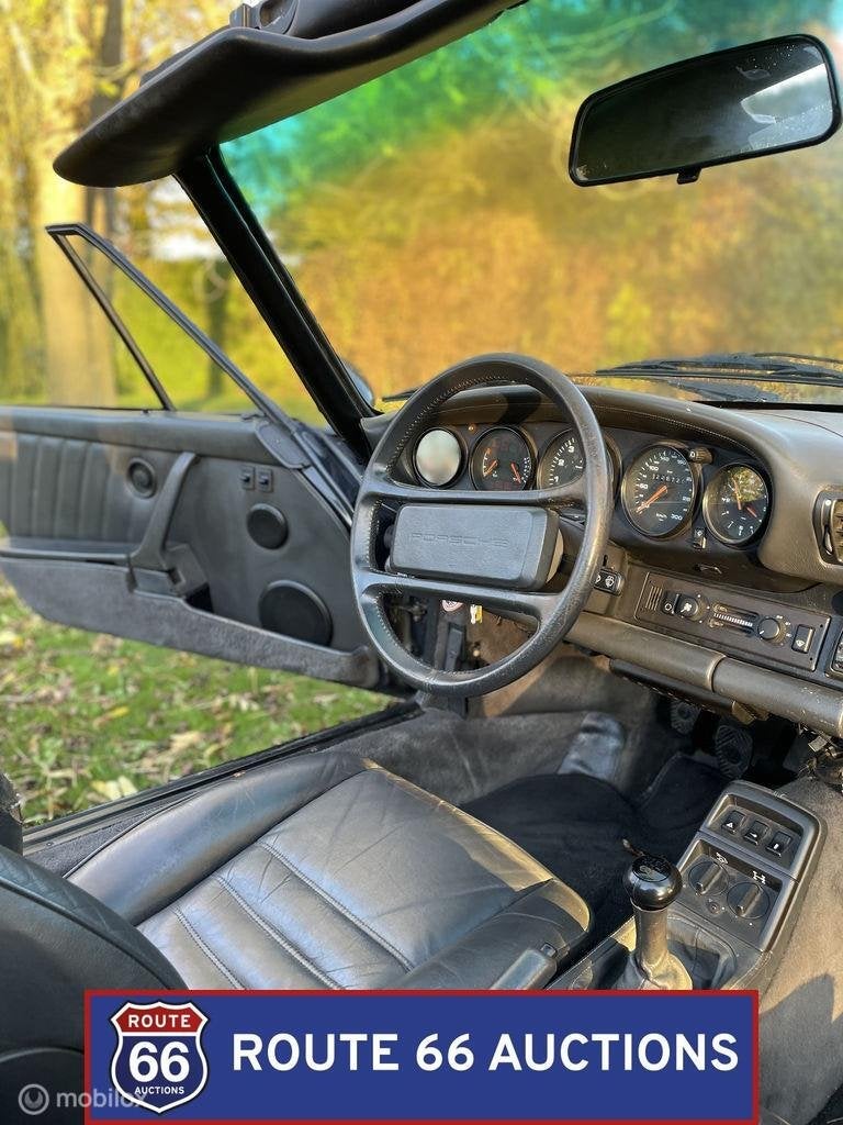 Porsche 911 Carrera 4 Cabriolet | 1990 | Route 66 Auctions, Auto's, Oldtimers, Overige carrosserieën, Zwart, Bedrijf, Porsche