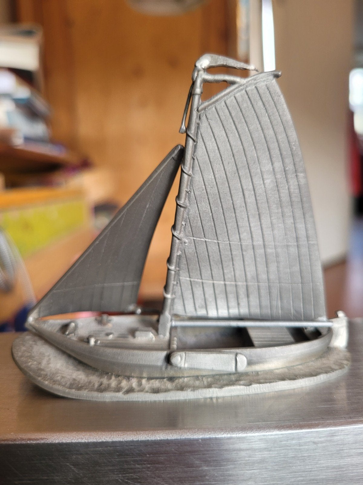 Zeilschip van tin., Ophalen