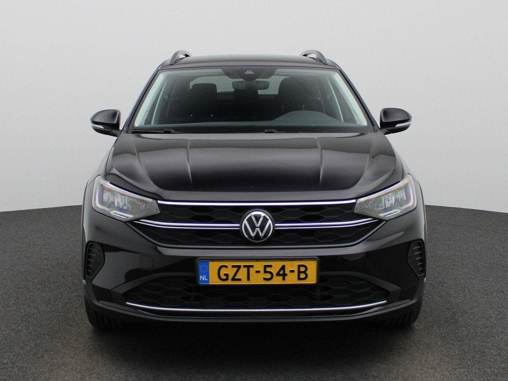 Volkswagen Taigo 1.0 TSI Oranje Edition 115 PK | Automaat |, Auto's, Volkswagen, 12 maanden, Stof, 116 pk, Zwart