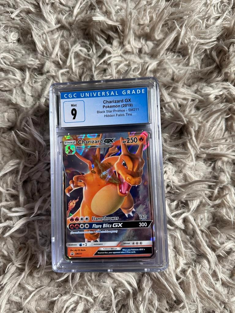 Pokémon Charizard GX CGC 9 - Black Star Promos SM211, Hobby en Vrije tijd, Verzamelkaartspellen | Pokémon, Ophalen of Verzenden