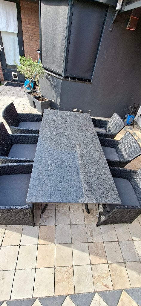 Tuintafel natuursteen met 6 zwarte stoelen en kussens, Ophalen, Gebruikt, Rechthoekig, Overige materialen