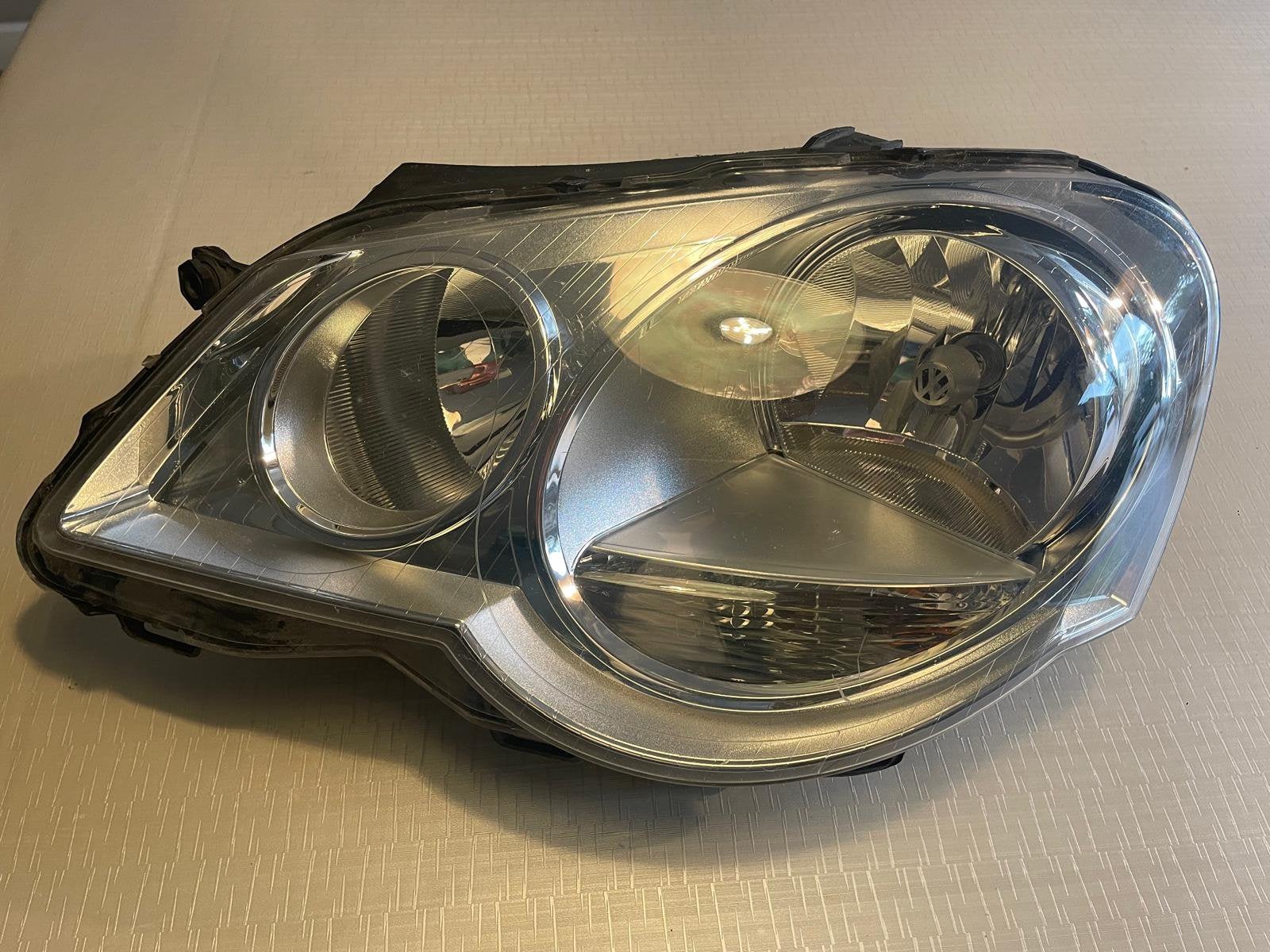 KOPLAMP LINKS VW POLO  ORIGINEEL BJ 2005-2009, Ophalen of Verzenden
