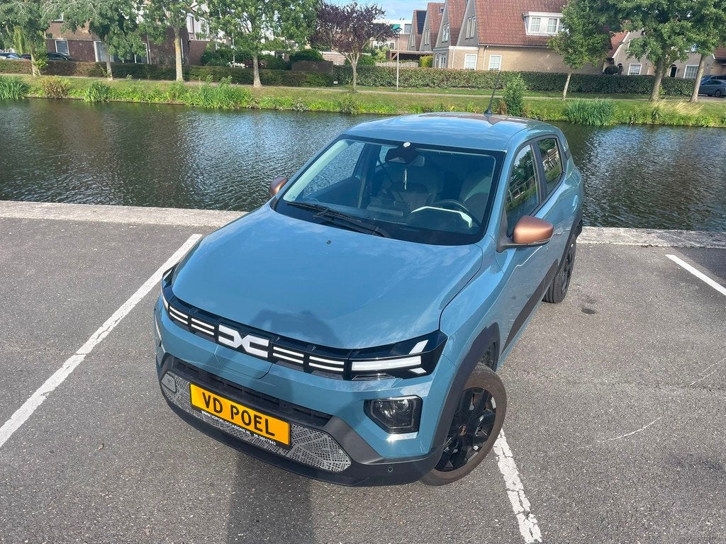 Dacia Spring Extreme 65 26.8 kWh NIEUWSTAAT NAVI AIRCO PDC, Auto's, Dacia, Gebruikt, Leder en Stof, Origineel Nederlands, 949 kg