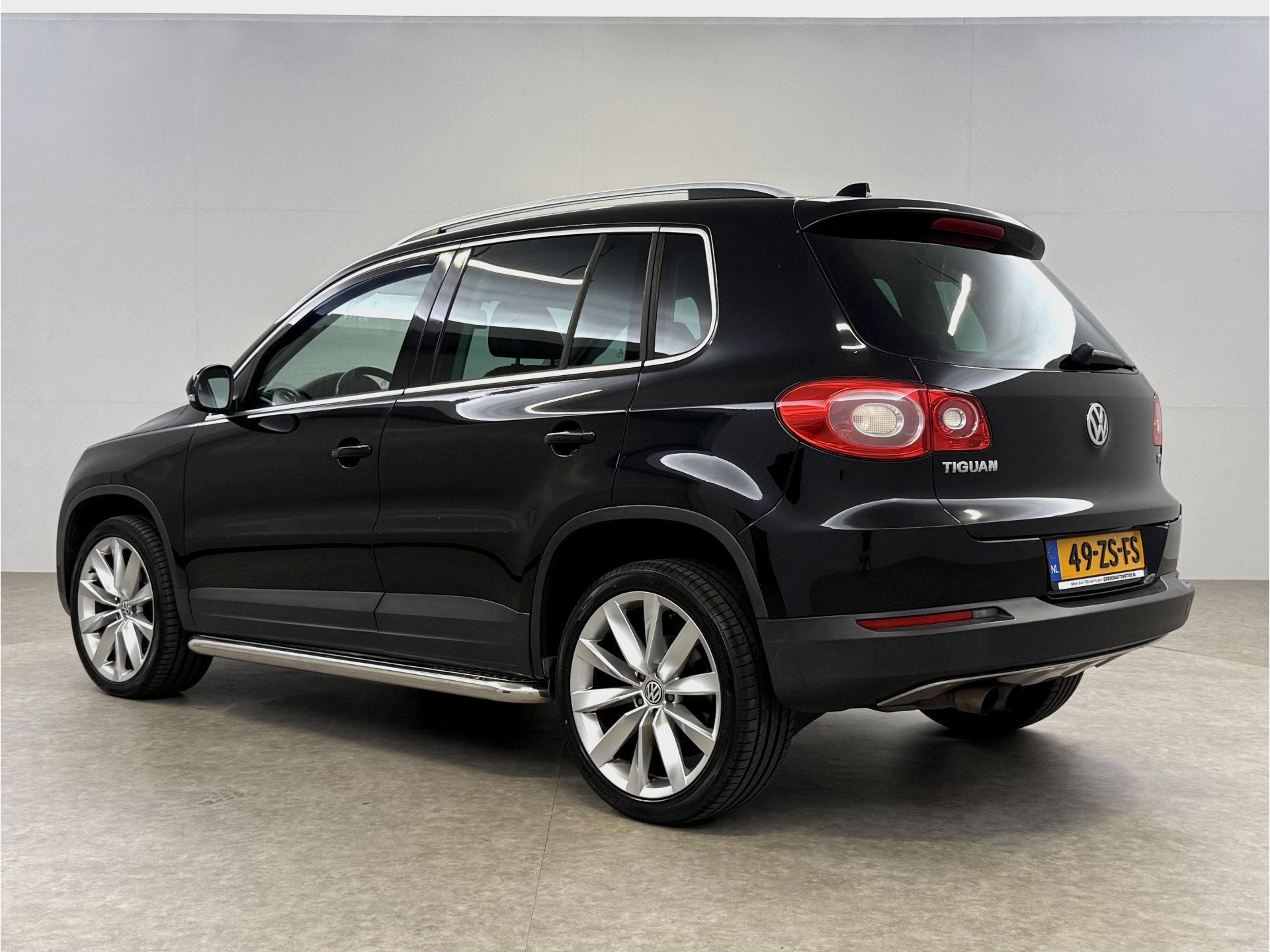 Volkswagen Tiguan 1.4 TSI 150PK | Cruise | Clima | Navi | St, Auto's, Gebruikt, 4 cilinders, Zwart, Bedrijf