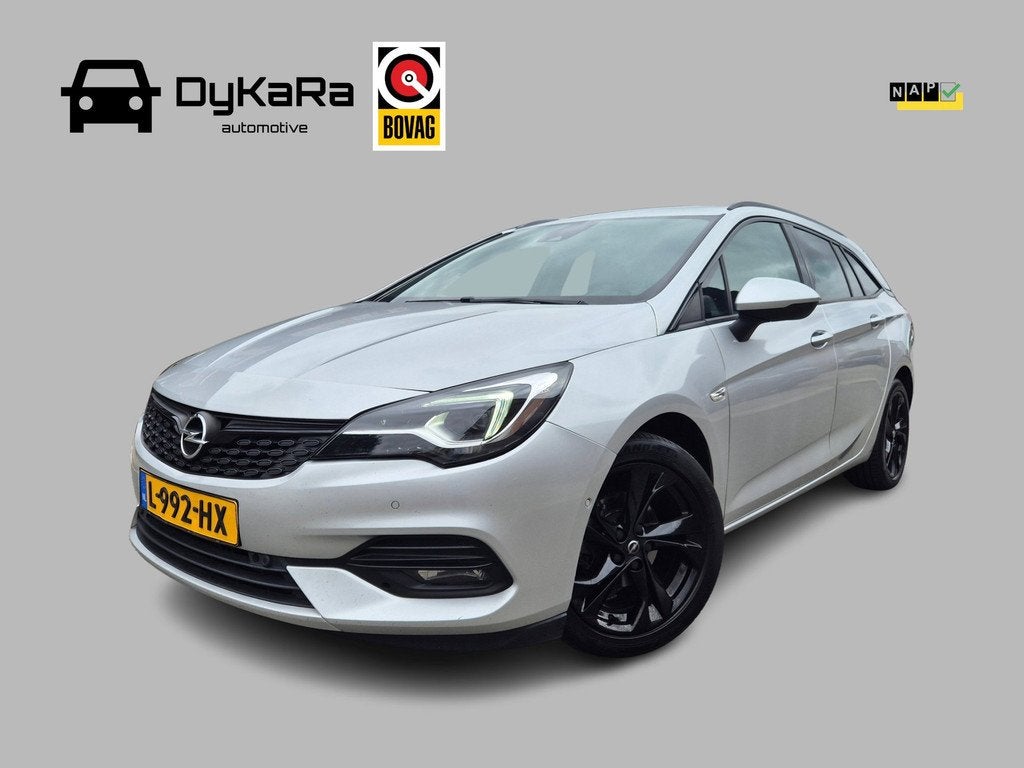 Opel Astra Sports Tourer 1.4 Ultimate Automaat, Trekhaak, Na, Auto's, Opel, Gebruikt, 146 pk, Grijs, 3 cilinders