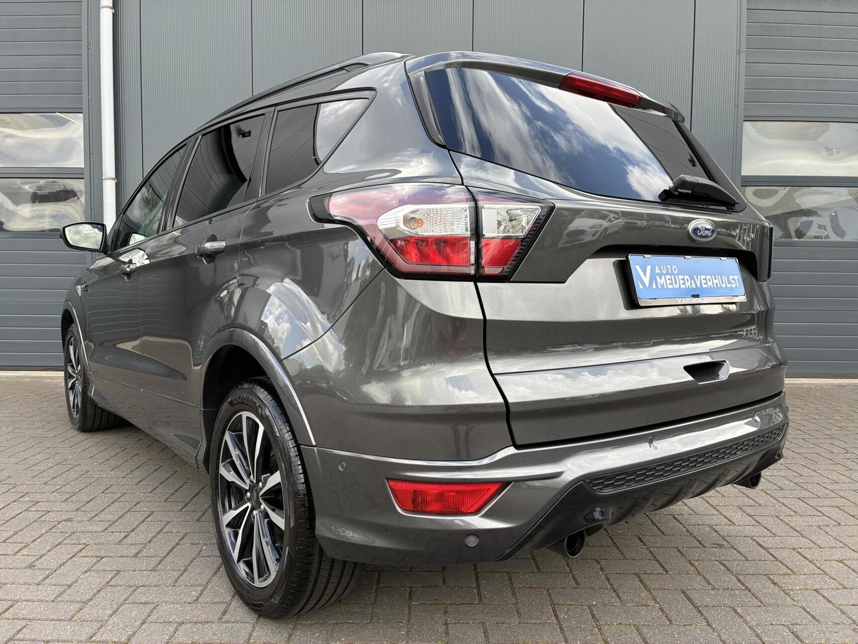 Ford Kuga 1.5 EcoBoost 150 PK ST-Line X | HALF-LEDER | NAVI, Auto's, Zwart, 4 cilinders, Leder en Stof, Bedrijf