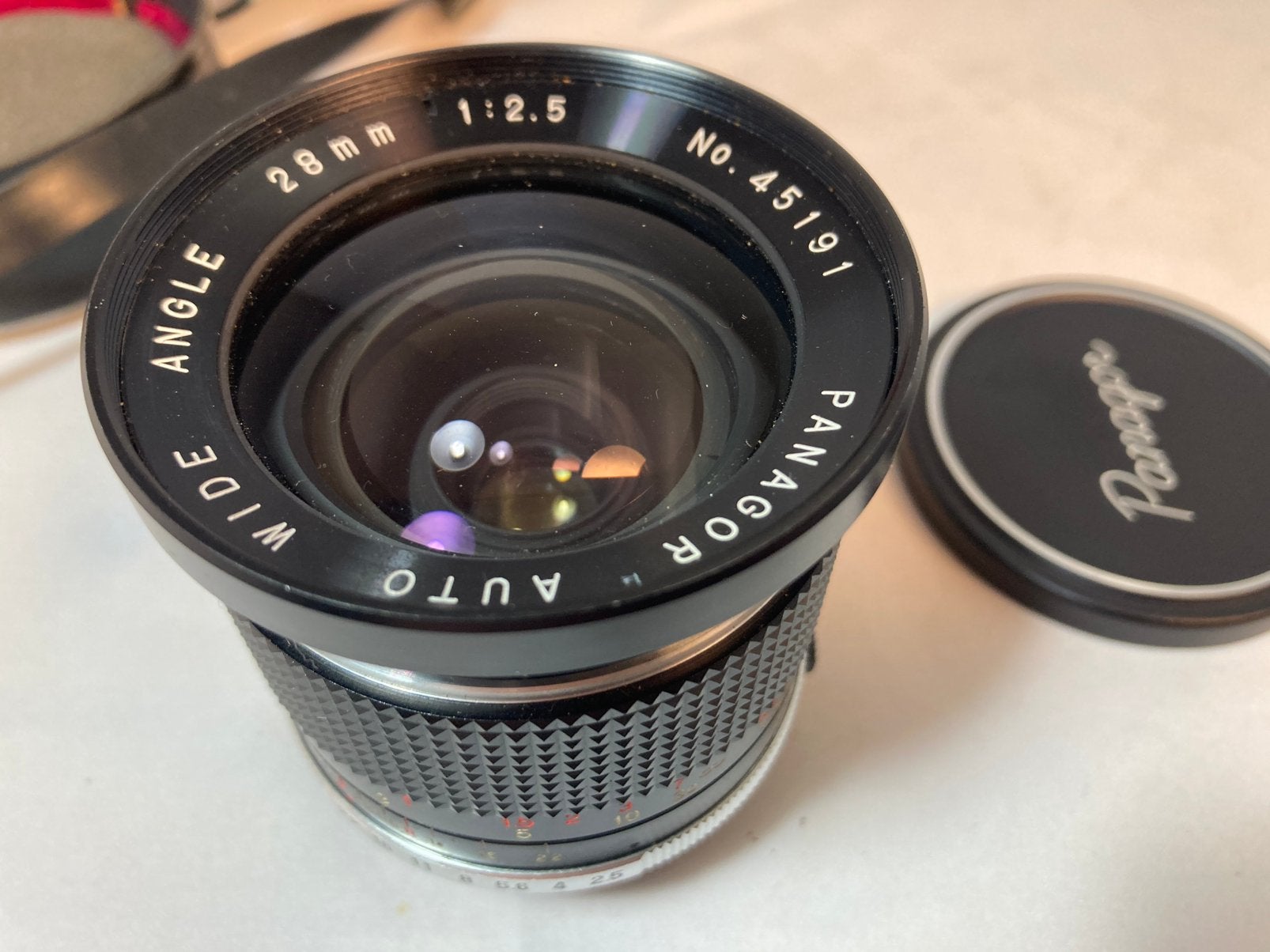 Panagor 28 mm onjectief (P-draad), Ophalen, Groothoeklens, Zo goed als nieuw, Zonnekap
