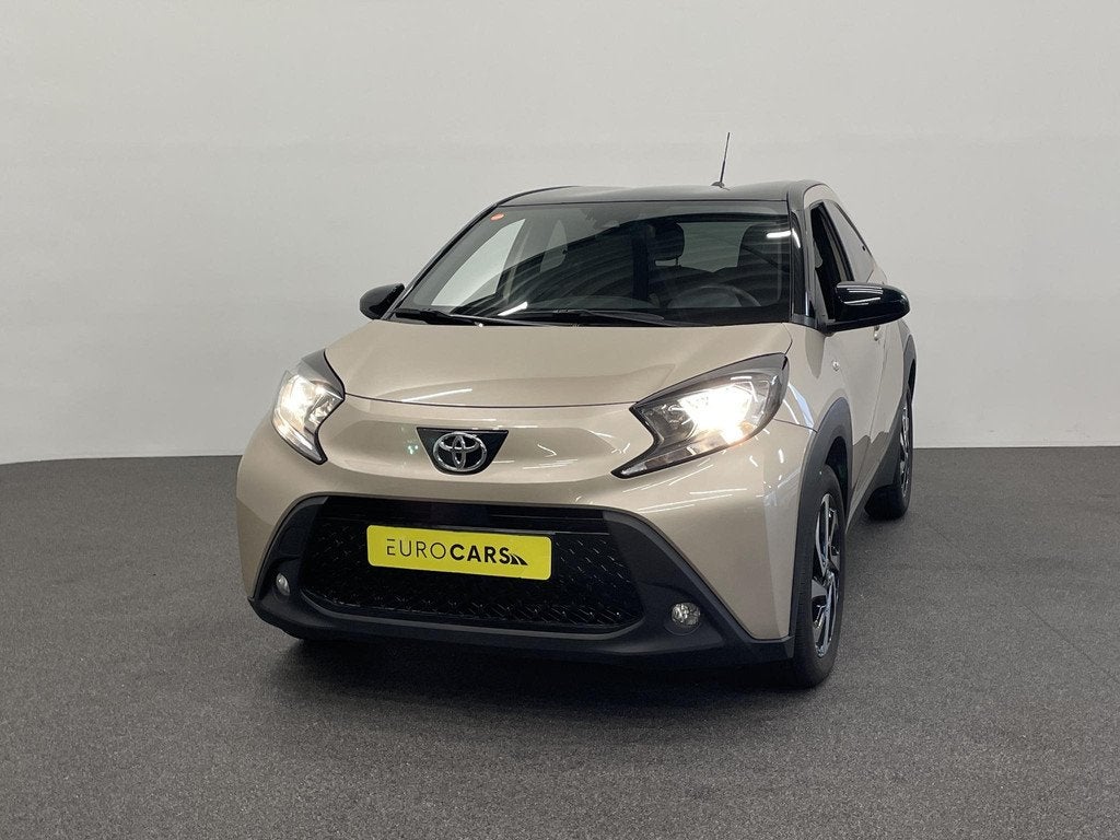 Toyota Aygo X 1.0 VVT-i Automaat Pulse Navigatie Apple Carpl, Auto's, Toyota, Stof, Gebruikt, Bruin, 4 stoelen