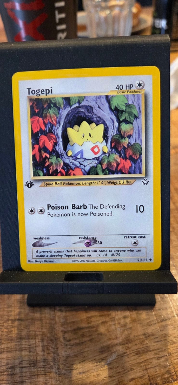 Togepi first edition 51/111, Hobby en Vrije tijd, Verzamelkaartspellen | Pokémon, Ophalen of Verzenden, Zo goed als nieuw, Losse kaart