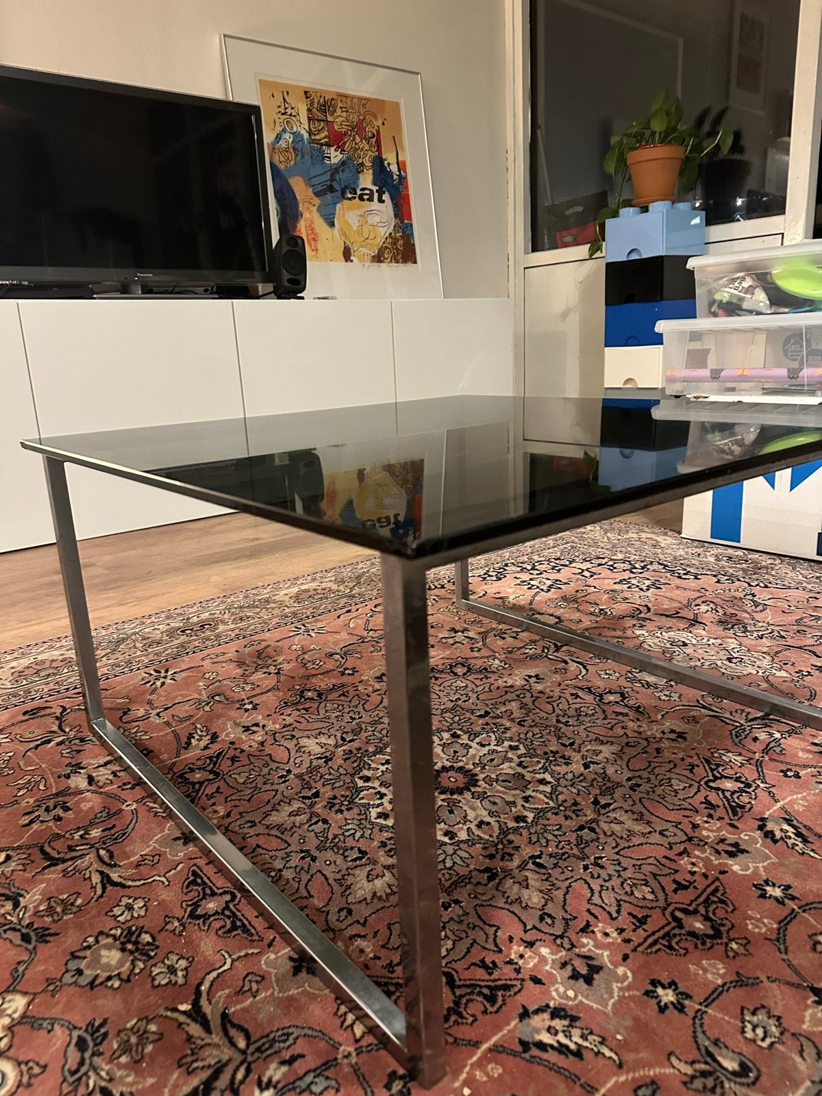 Gerookte glazen salontafel met chrome onderstel, Ophalen, Gebruikt, 100 tot 150 cm, Vierkant