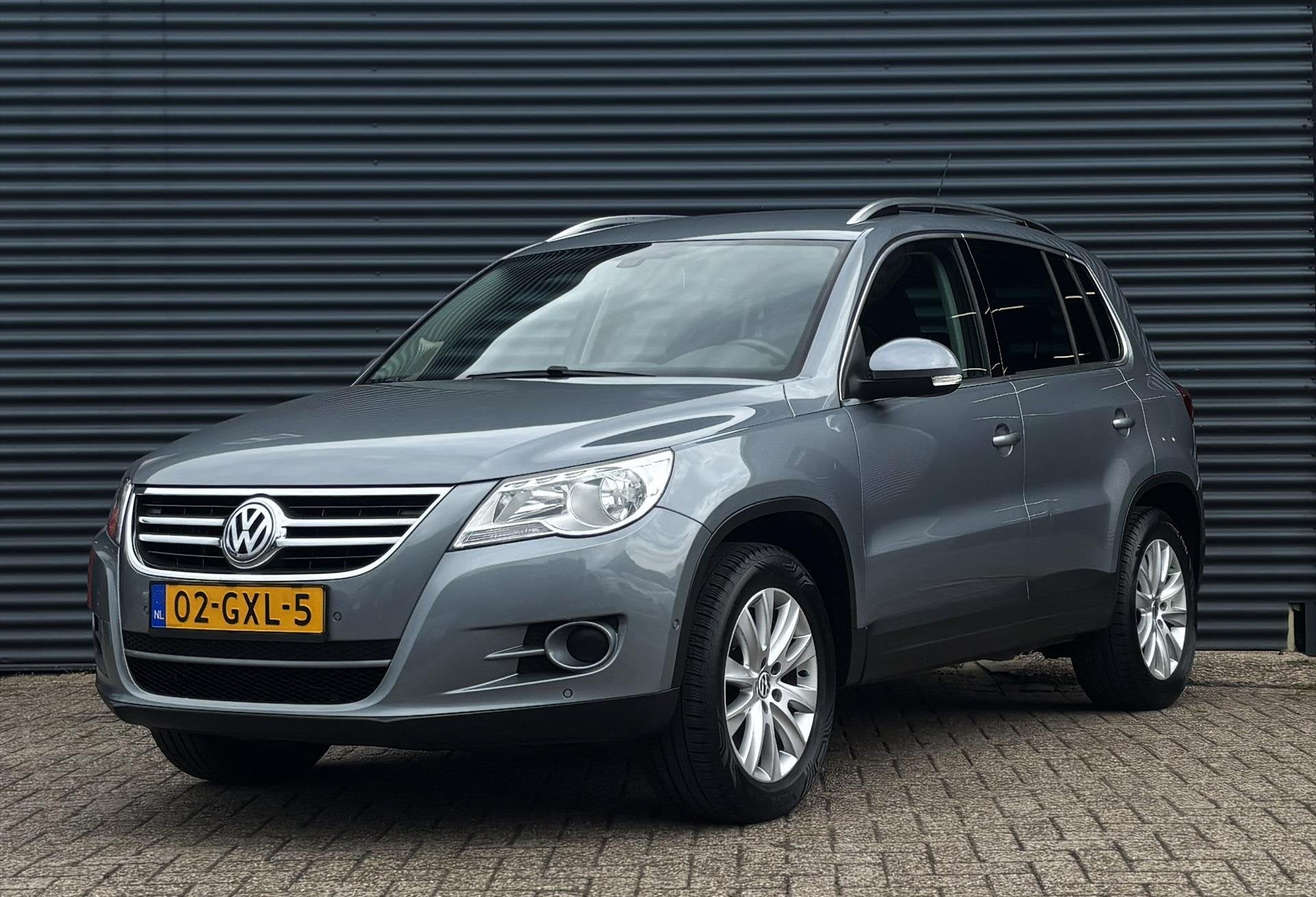 Volkswagen Tiguan 1.4 TSI 150PK 4MOTION, Auto's, Stof, Gebruikt, Zwart, 4 cilinders
