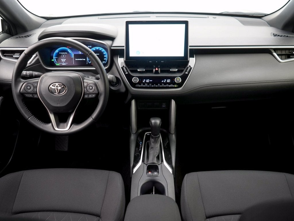 Toyota Corolla Cross Hybrid 140 Active | Navigatie | Camera, Auto's, Stof, Gebruikt, Zwart, Hybride Elektrisch/Benzine