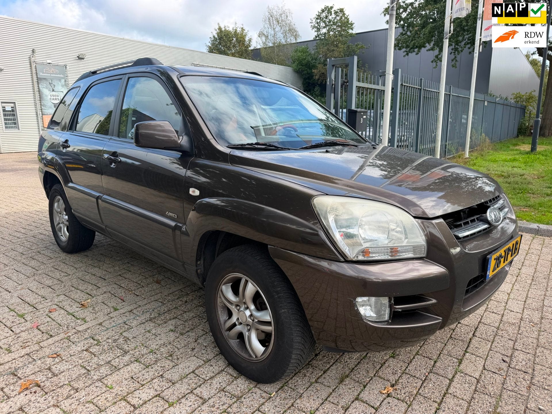 Kia Sportage 2.7 V6 M-bition 4WD 235.603 km rijd perfect net, Auto's, Automaat, Gebruikt, Bruin, 2656 cc