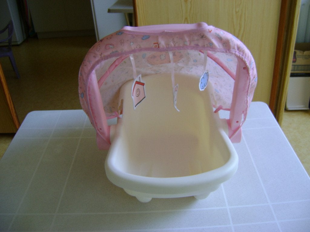 roze baby annabel maxi cosy met kap met 3speeltjes er aan, Ophalen of Verzenden, Zo goed als nieuw, Babypop