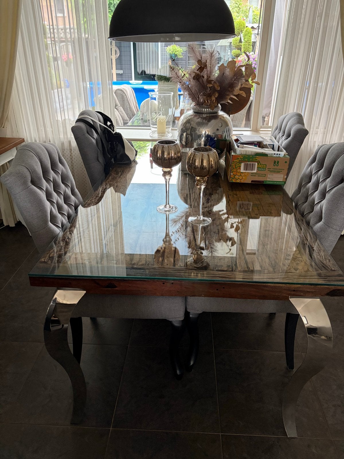 Eettafel met glazen blad en metalen poten, Ophalen, 50 tot 100 cm, Zo goed als nieuw, 150 tot 200 cm