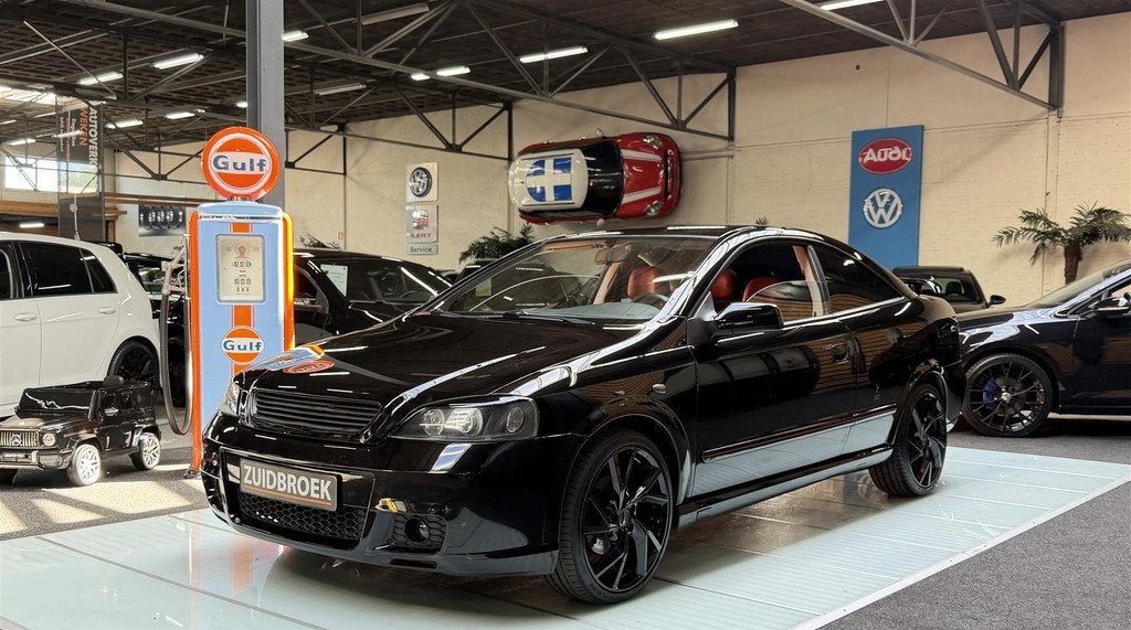 Opel Astra Coupe 1.8 Airco | Stoelverwarming | 18'' Sportvel, Auto's, Elektrische ramen, 116 pk, Zwart, Leder