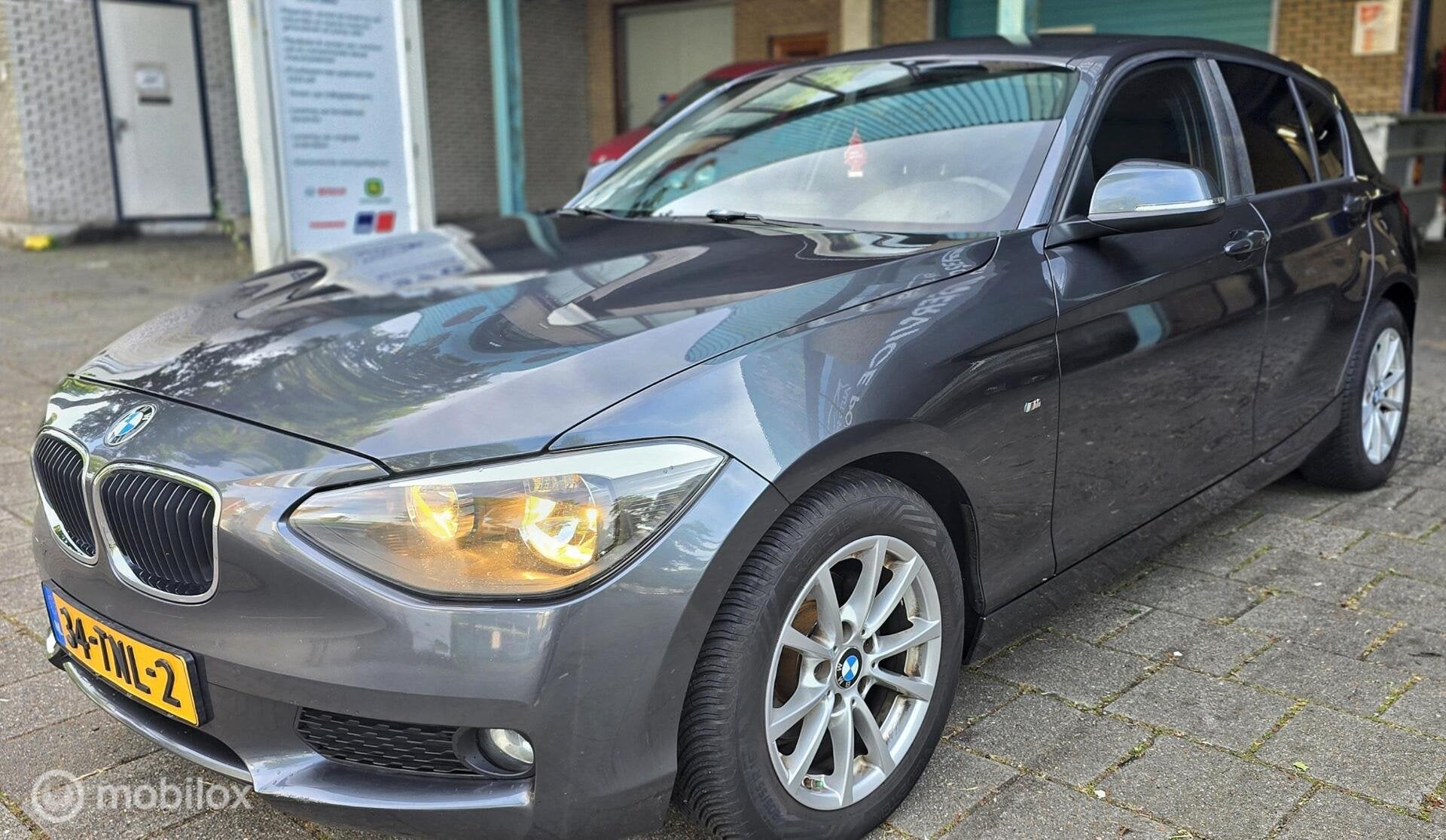 BMW 1-serie 116i Business+ Automaat, Auto's, Euro 5, Gebruikt, 4 cilinders, Origineel Nederlands