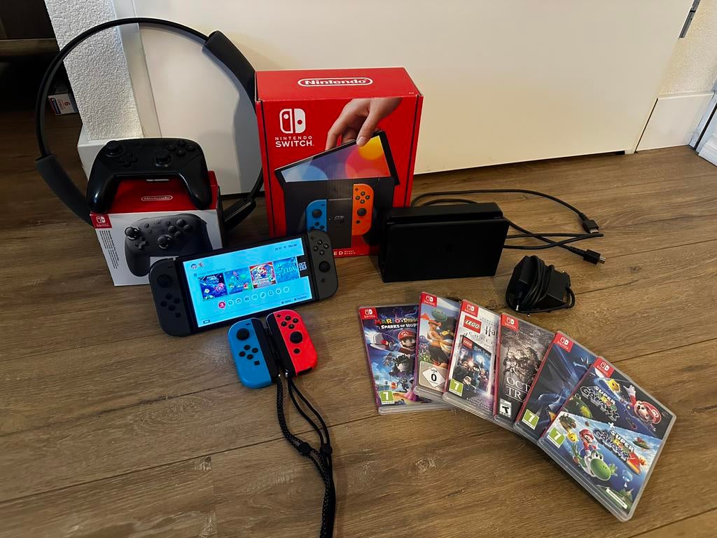 Nintendo Switch OLED zwart met 6 games, 5 controllers, Spelcomputers en Games, Switch OLED, Met games, Ophalen of Verzenden, Zo goed als nieuw