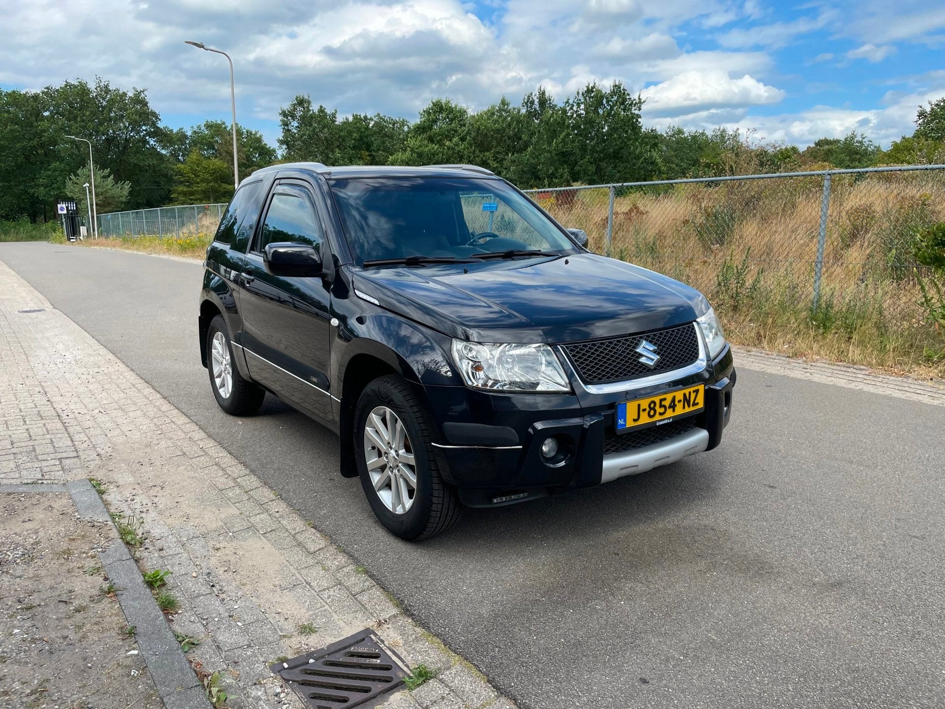 Suzuki Grand Vitara 1.6-16V JLX Super Leuke Vitara, Auto's, 1345 kg, Gebruikt, Zwart, 4 cilinders