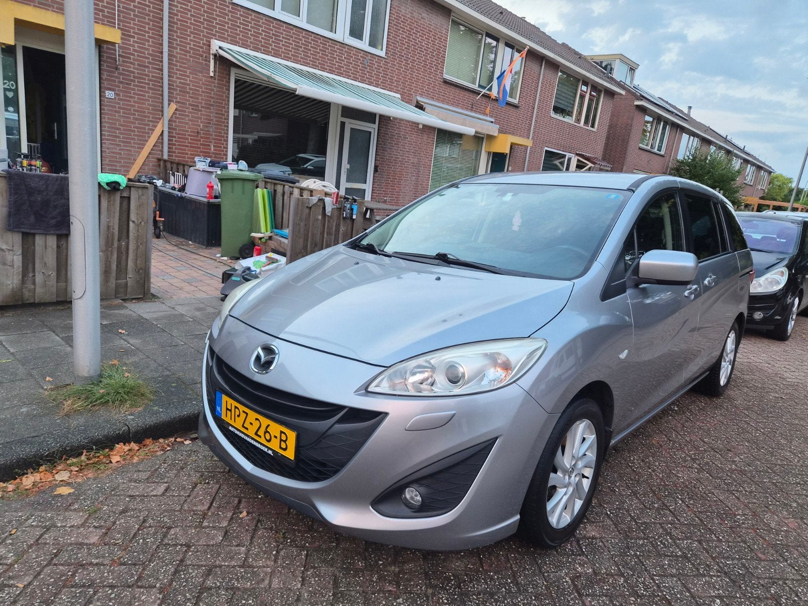 Mazda 5 1.8 115pk 2011 Grijs, Auto's, Voorwielaandrijving, 4 cilinders, 7 stoelen, 14 km/l