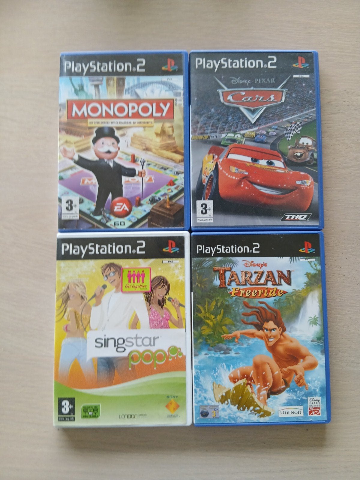 Vier PS2 games: Monopoly, Cars, Singstar, Tarzan, Gebruikt, Overige genres, Eén computer, Ophalen of Verzenden