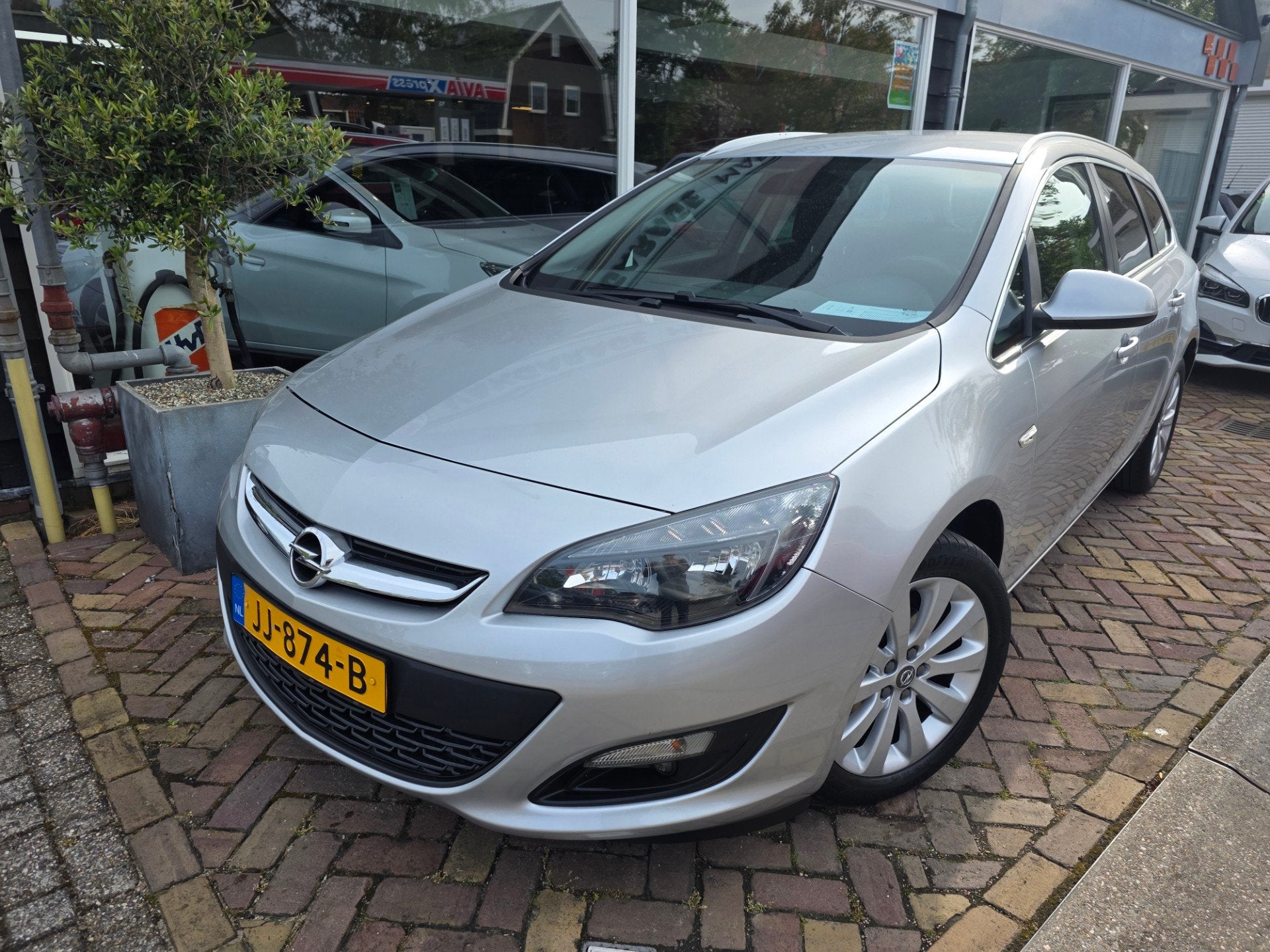 Opel Astra Sports Tourer 1.4 Turbo Blitz, Auto's, Gebruikt, Euro 6, 4 cilinders, Origineel Nederlands
