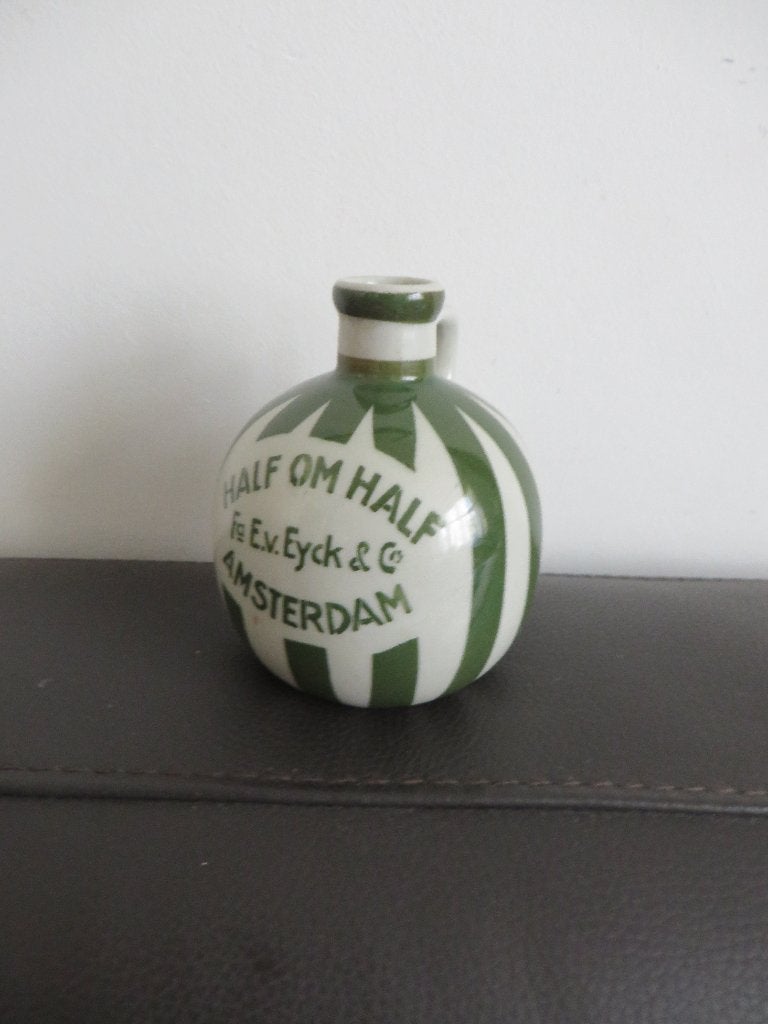 Oud drank flesje, Bunzlau, firma E. van Eyck Amsterdam, Ophalen of Verzenden, Gebruikt, Verpakking