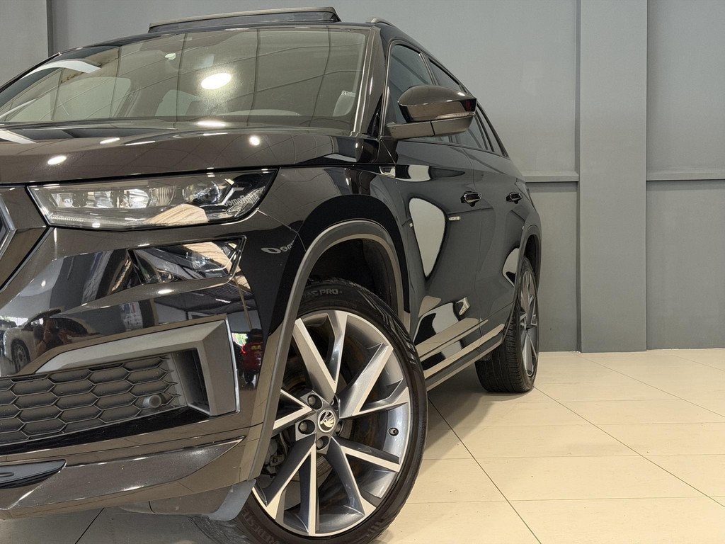 Skoda Kodiaq 1.5 TSI Sportline Business | Trekhaak | Panoram, Auto's, Skoda, 4 cilinders, 150 pk, Zwart, Bedrijf