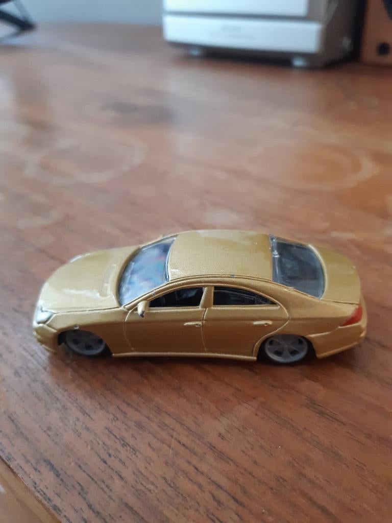 Burago Mercedes Benz cls. Goud., Ophalen of Verzenden, Auto