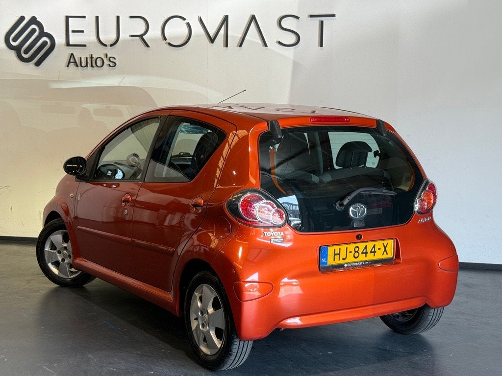 Toyota Aygo 1.0 VVT-i Comfort Orange Airco 5d Elektrische Ra, Auto's, Toyota, Voorwielaandrijving, Euro 5, Stof, Gebruikt