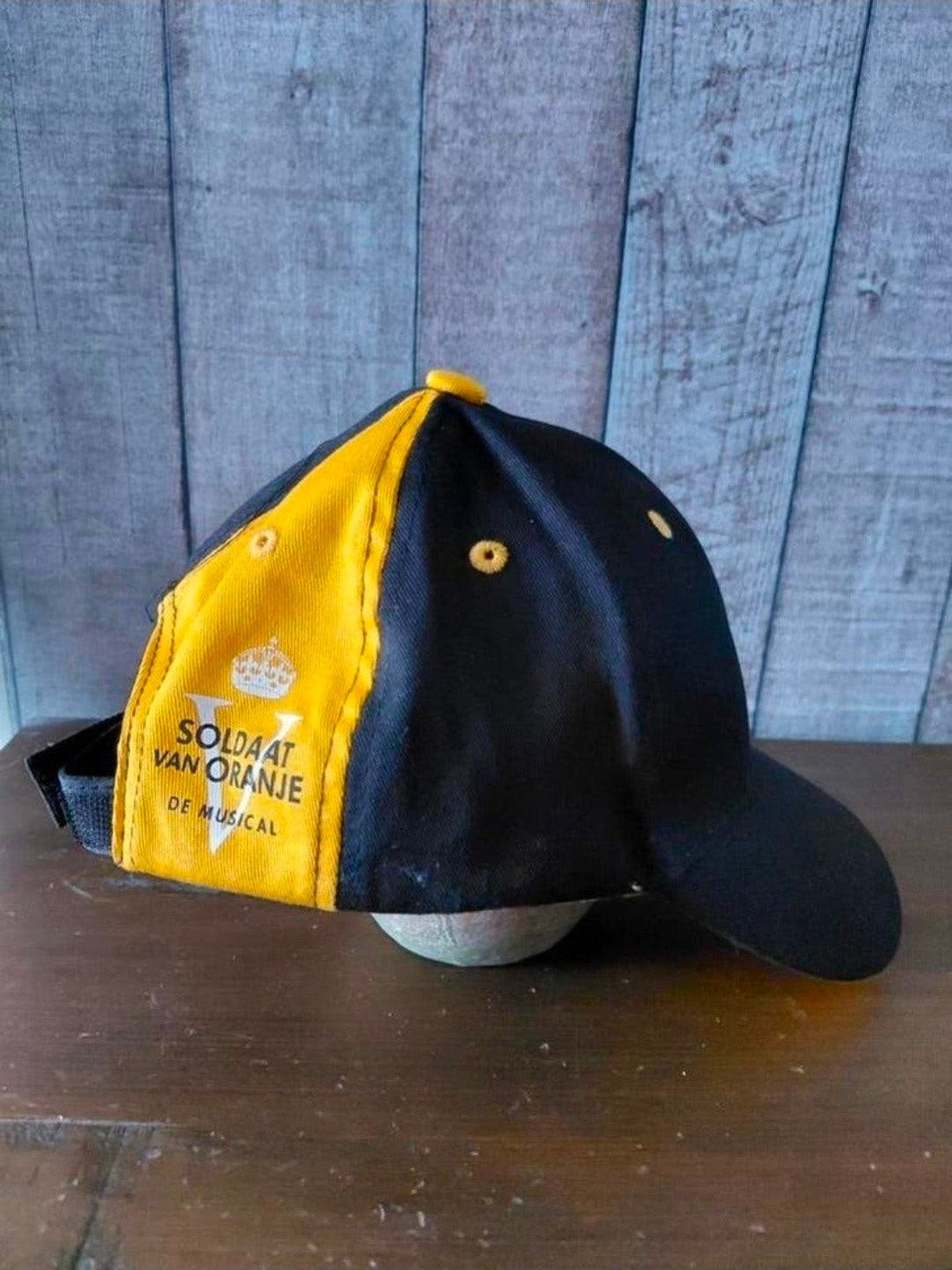 Soldaat van Oranje de Musical officiële merchandise pet., Ophalen of Verzenden, Gebruikt, Kleding