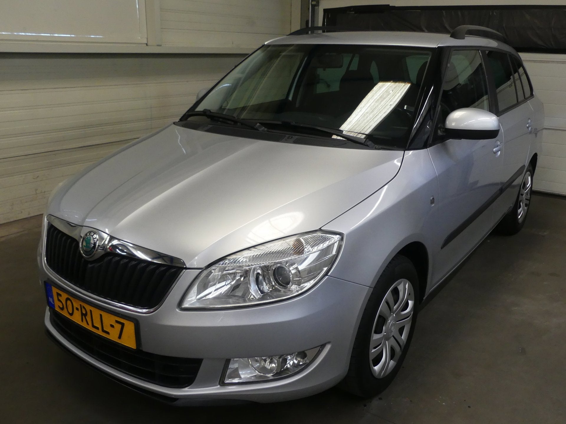 Skoda Fabia Combi 1.2 TSI Ambition - Trekhaak - Cruise Contr, Voorwielaandrijving, Euro 5, Zwart, 4 cilinders