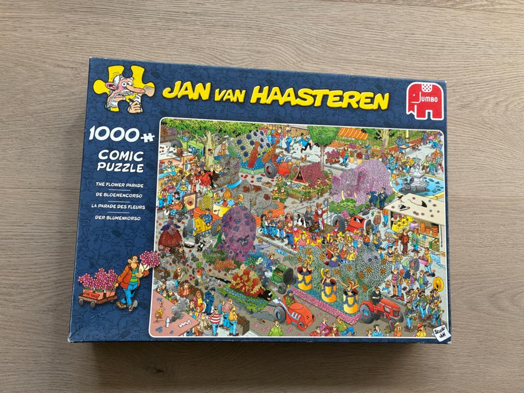 Jan van Haasteren De Bloemencorso 1000+ stukjes, Ophalen of Verzenden, 500 t/m 1500 stukjes, Zo goed als nieuw, Legpuzzel