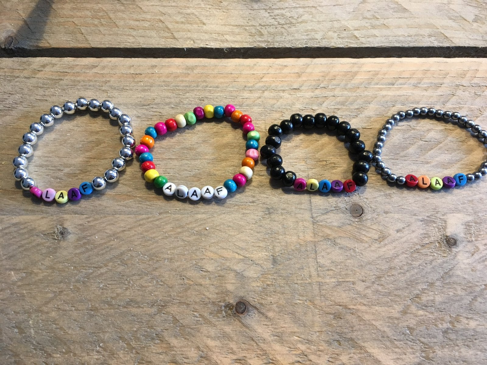 Alaaf armbandjes, Ophalen of Verzenden, Nieuw, Elastiek, Met bedels of kralen
