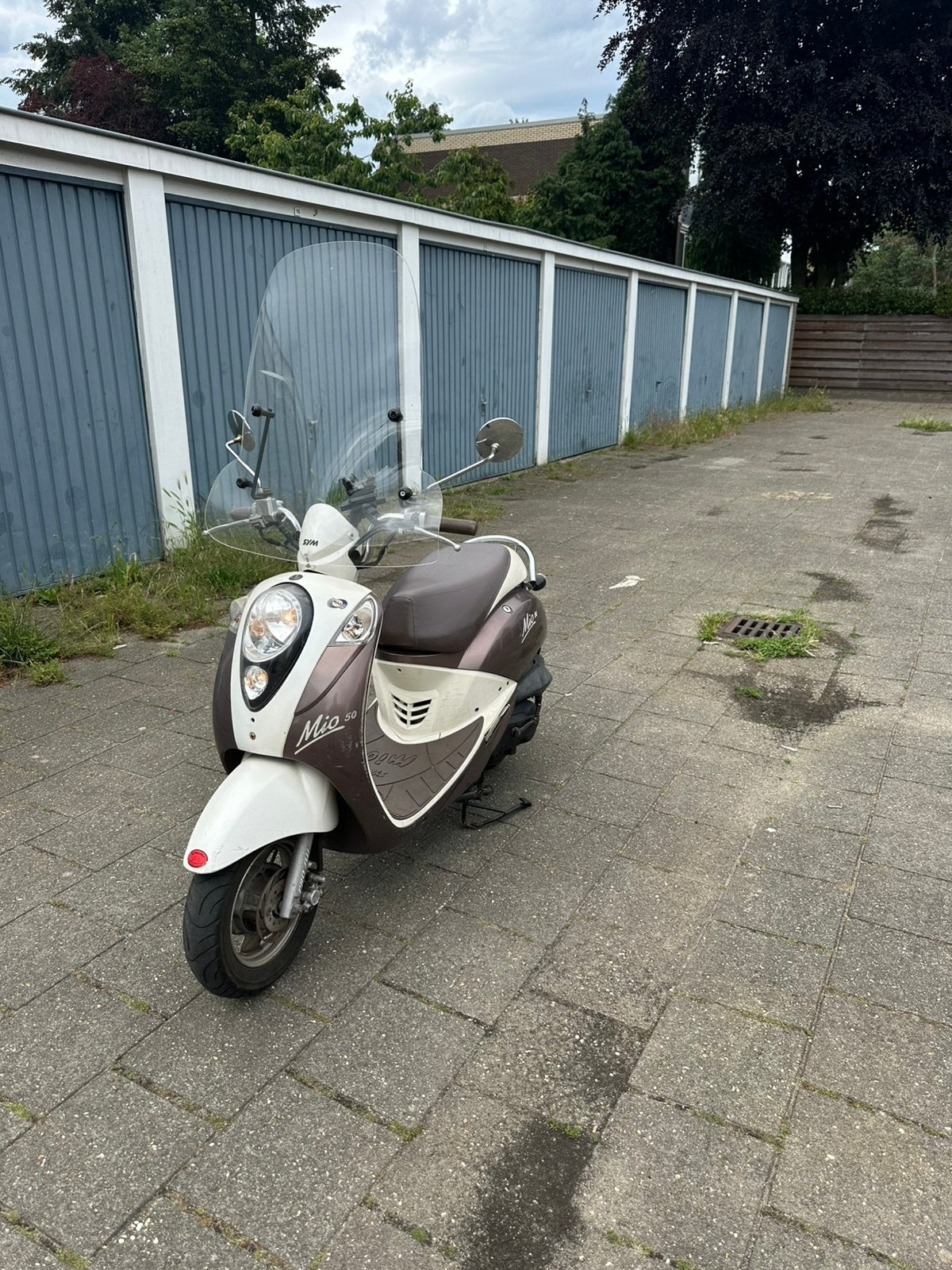 Sym mio snorscooter, Fietsen en Brommers, Scooters | SYM, Ophalen of Verzenden, Zo goed als nieuw, Benzine, Mio