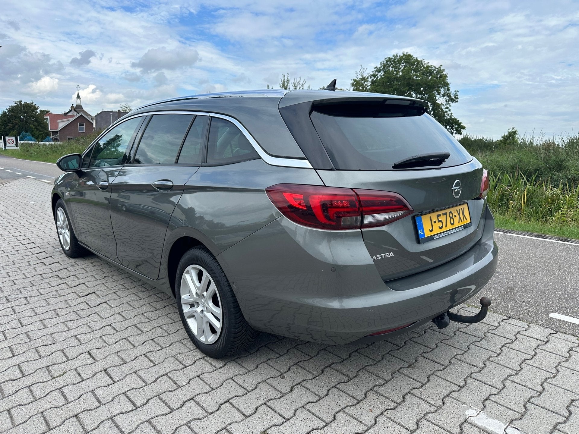 Opel Astra Sports Tourer 1.4 Turbo Innovation, Carplay, Trek, Automatische klimaatregeling, Gebruikt, Euro 6, Leder en Stof
