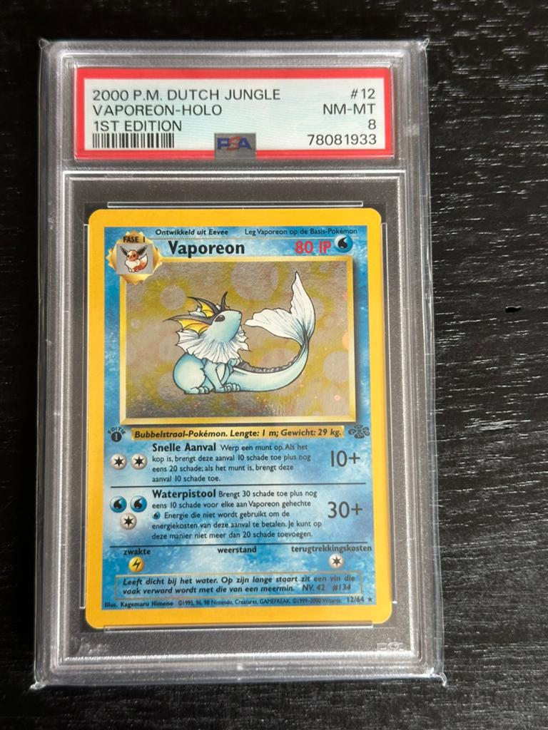 Pokemon Vaporeon Holo 1st Edition Dutch PSA 8 Jungle WOTC, Ophalen of Verzenden, Zo goed als nieuw