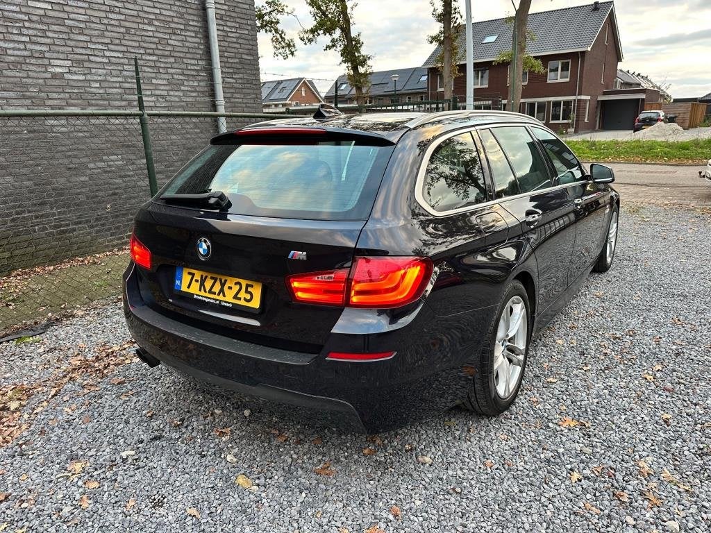 Foto 4 van BMW 5-serie Touring 520i High Executive netteauto/keurigonde